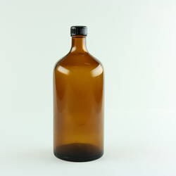 Brown glass bottle. Black lid.