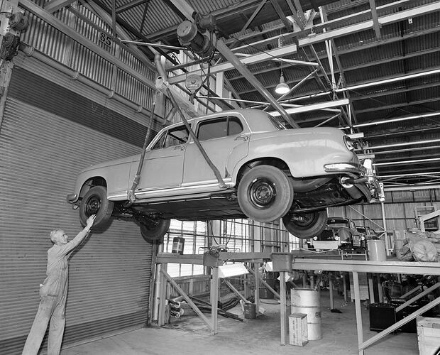 Car Suspended in a Mechanics, Port Melbourne, 09 Jun 1959