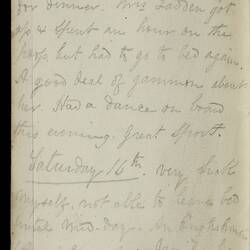 Open diary with handwritten text on discoloured worn page.