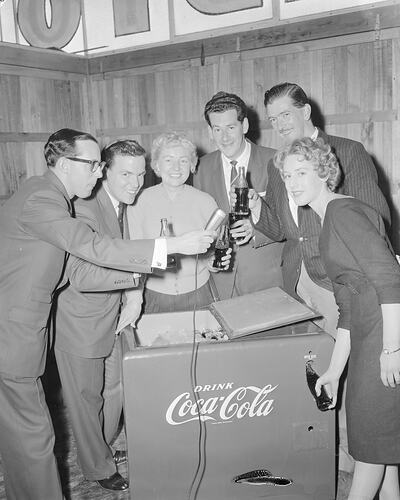 Coca-Cola Company, Group Standing with a Refrigerator, Royal Melbourne Show, Flemington, Victoria, 23 Sep 1959