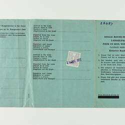 Green paper with five vertical creases, with printed text.