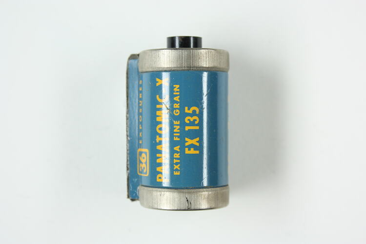 Cylindrical cartridge with blue, pressed metal label.