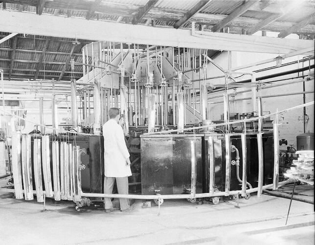 Monochrome photograph of a factory worker.