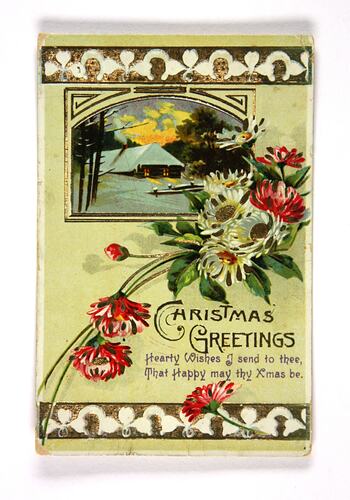Front of card with flowers and house in snow.