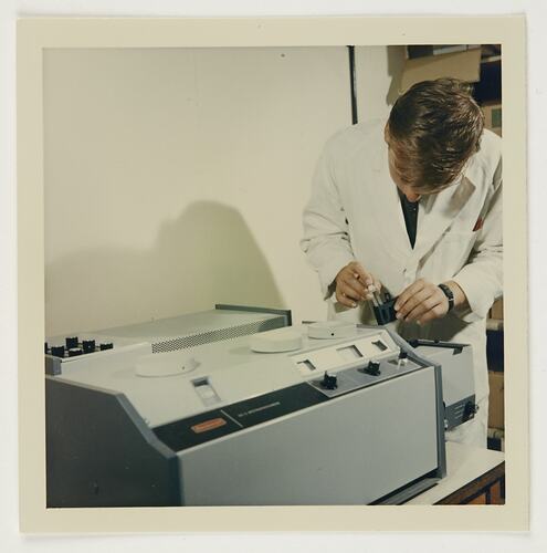 Slide 197, 'Extra Prints of Coburg Lecture', Worker Measuring Chemicals on Spectrophotometer, Kodak Factory, Coburg, circa 1960s