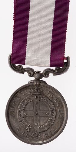 Medal with southern cross suspended from bugundy and white ribbon.