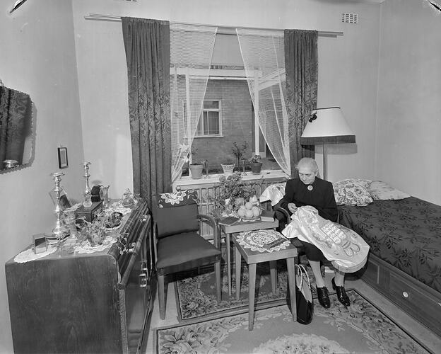 Australian Jewish Welfare & Relief Society, Woman Sewing in a Bedroom, South Yarra, Victoria, Nov 1958