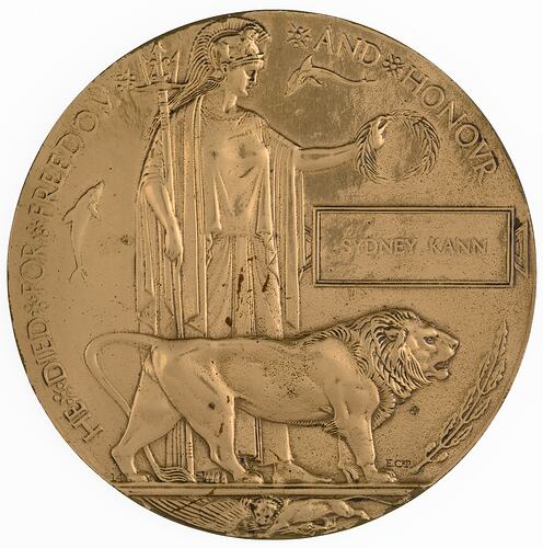Gold coloured medal with lion and woman holding trident and wreath.