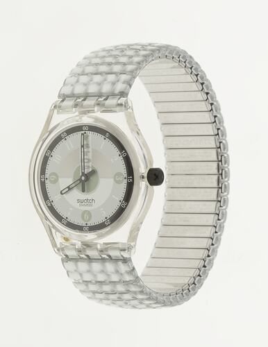 Silver wristwatch with quartered manual clock face and gridded band.