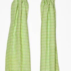 Miniature green and white chequered curtains from a doll's house.