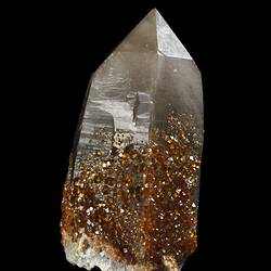 Orange crystals on a larger white prism.