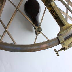 Brass scientific instrument, overhead view, detail.