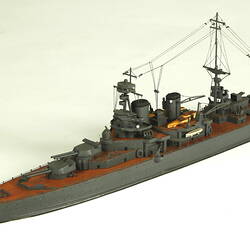 Naval ship with two masts, three quarter view.