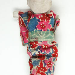 Small Japanese doll in kimono, back side.
