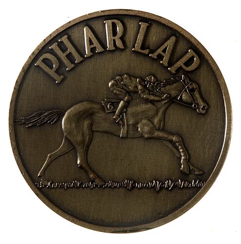 Bronze medal with race horse design.