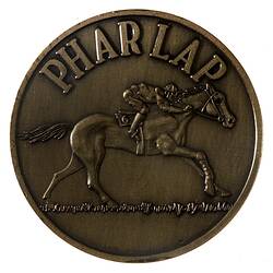 Bronze medal with race horse design.