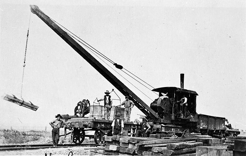 Workers unloading sleepers on the Moorabool Bridge, Geelong district, circa 1915.
