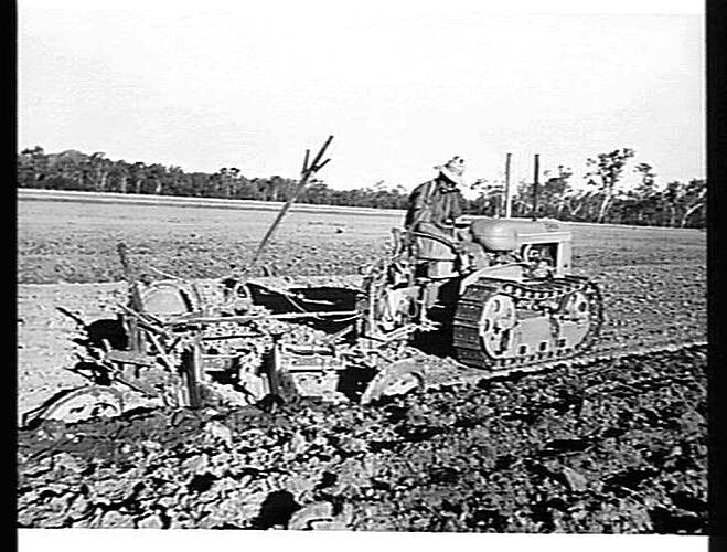 H.H. PERRY, ETON VIA MACKAY, QLD. MODEL H.G. CLETRAC HAULING 2-FUR NO. 4 S PLOUGH (PLOUGHING 12