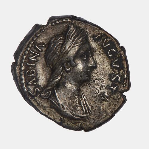 Roughly round coin with male head facing right. Text around.