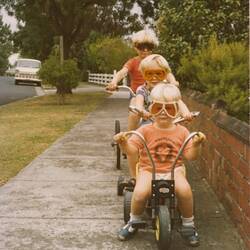 Digital Photograph - Three Children in Goggles Riding Bikes on Footpath, Brighton East, 1979
