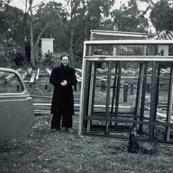 Digital Photograph - Man Standing by Window Frames, First Home Building Site, Nunawading, 1952