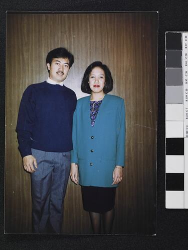 Man and woman standing posing.