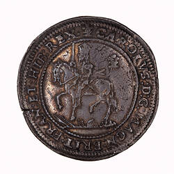 Coin, round, within a circle of beads, crowned King wearing armour and a long scarf, holding sword upright.