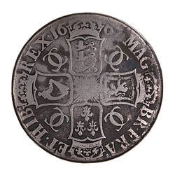 Coin, round, four crowned shields bearing the arms of England, Scotland, France and Ireland; text around.