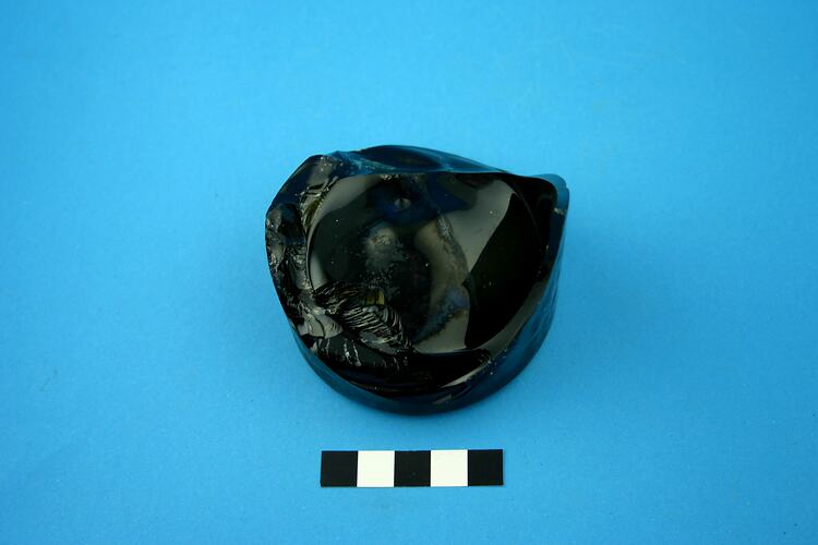 Dark green glass bottle base.