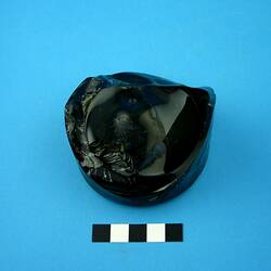 Dark green glass bottle base.