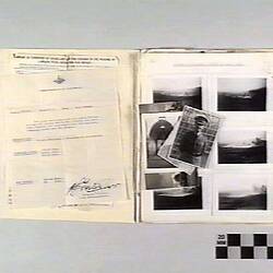 Open book page, types documents on left page, black and white photographs on right page.