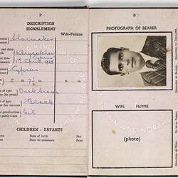 Open passport with white pages and black printing. Black and white photo of man. Stamped.