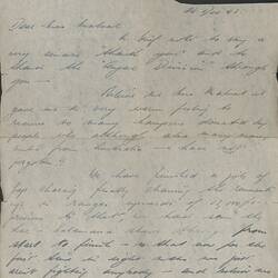 Single page on with blue handwritten text, with fold lines on page and section in top-right corner cut out.