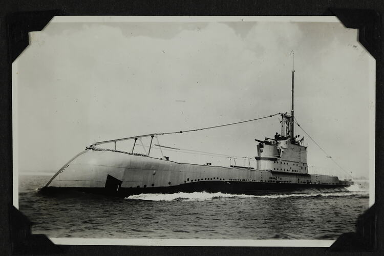 Submarine surfaced in ocean.