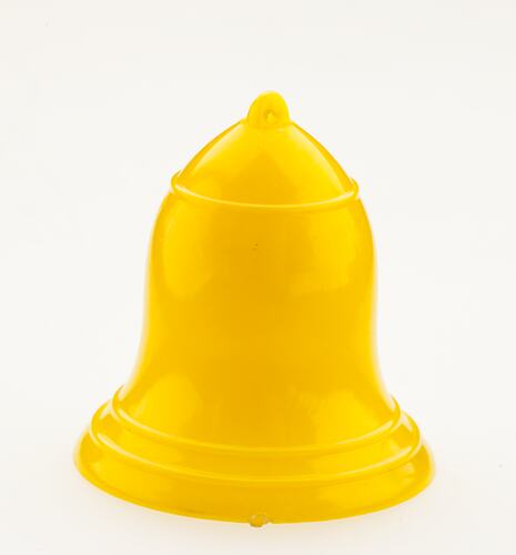 Small, bright yellow, plastic bell.
