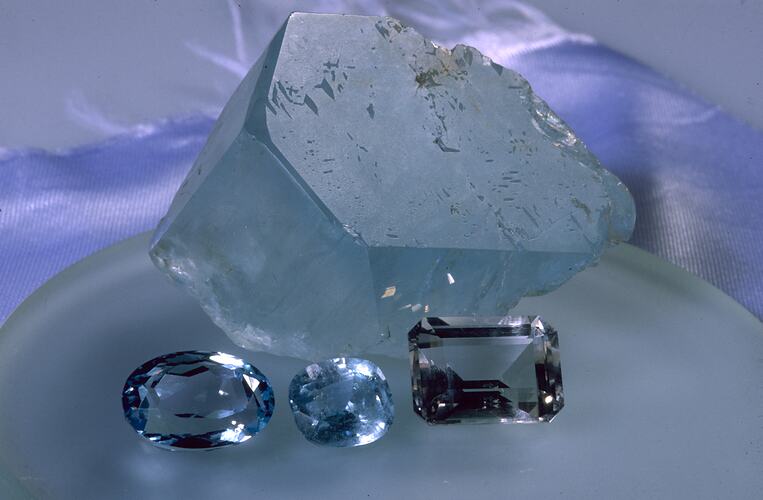 Cut and uncut topaz crystals.