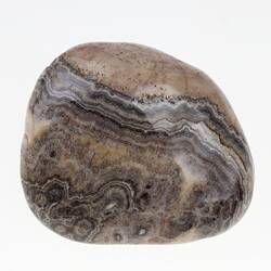 Brown agate pebble with black and white bands.