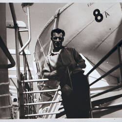 Negative - Man Standing on Deck in Front of Lifeboat, MV Fairsea, 1957