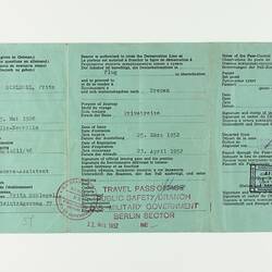 Green paper with five vertical creases, with printed text, stamp marked in three places.