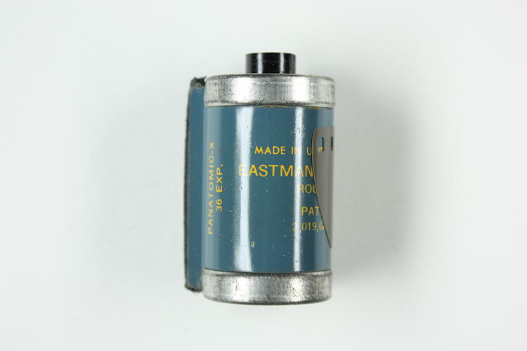 Cylindrical cartridge with blue, pressed metal label.