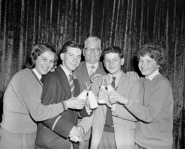 Group Holding Milk Bottles, Victoria, 02 Oct 1959
