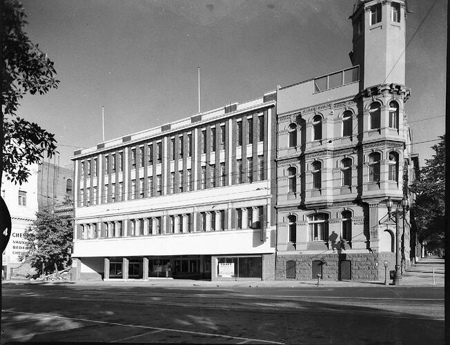 Monochrome photograph of a building exterior.