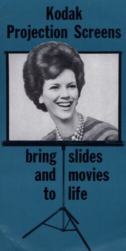 Leaflet with photograph of woman on projection screen.