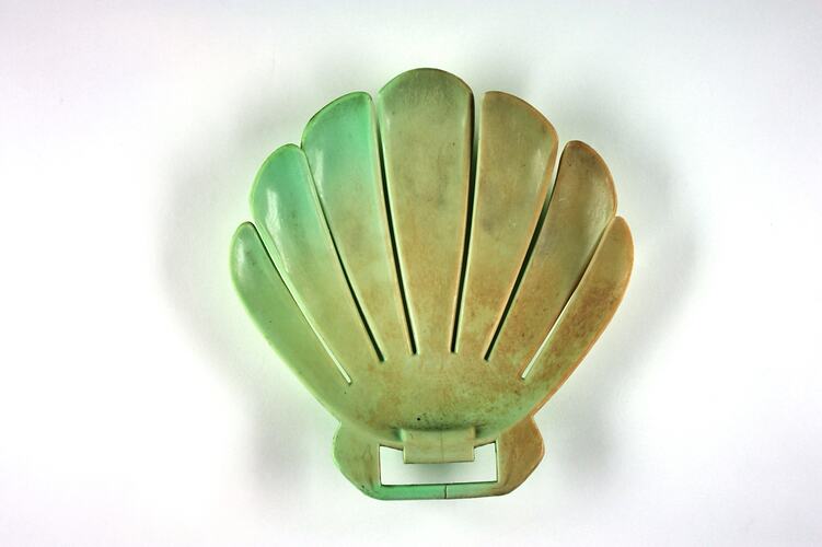 Shell-shaped green plastic form