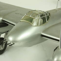 Silver model aeroplane.
