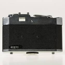 All-metal chrome and black body 35mm camera. Back view.