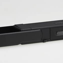 Long rectangular black plastic camera.