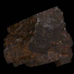 Reddish black rock.