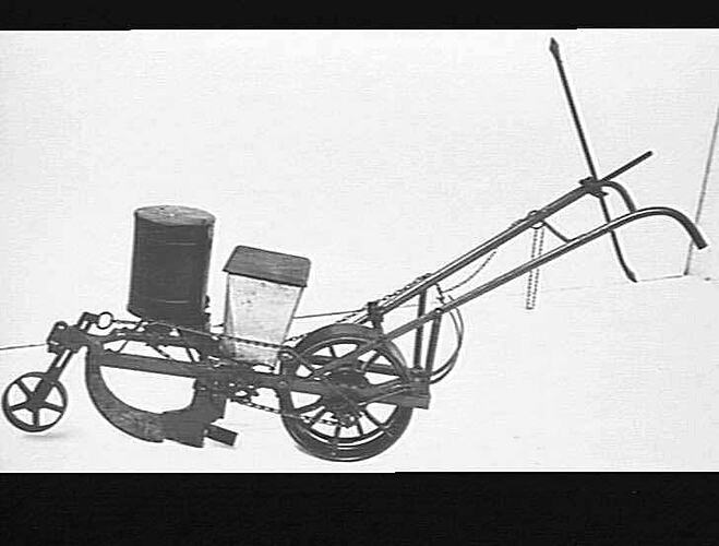 A MASSEY-HARRIS COTTON PLANTER FITTED WITH FERTILIZER BOX: AUG 1931