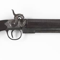 Belt pistol with curved handle and octagonal barrel.